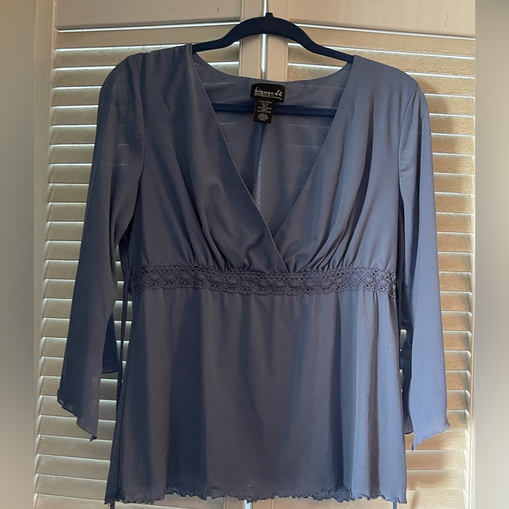 Blue blouse with low cut neck line and ties in back 3/4 sleeve